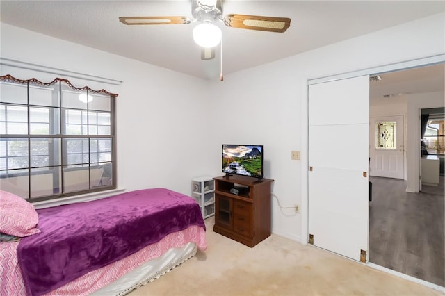 1148 Monroe Ave, Saint Cloud, FL 34769 - bedroom with a ceiling fan and carpet floors