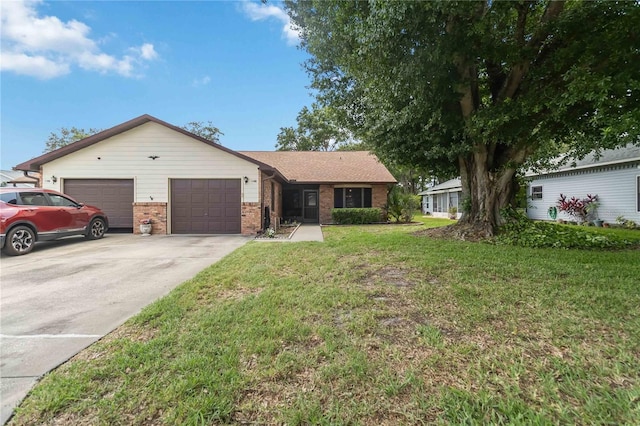 1148 Monroe Ave, Saint Cloud, FL 34769 - ranch-style house featuring an attached garage, a front lawn, driveway, and brick siding