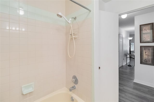 1148 Monroe Ave, Saint Cloud, FL 34769 - full bath featuring shower / tub combination, wood finished floors, and baseboards