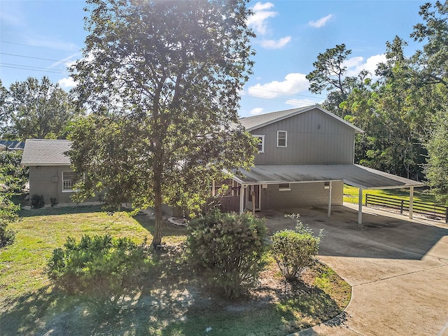 1661 Votaw Rd, Apopka, FL 32703 - view of front of home featuring a front lawn, a carport, and driveway