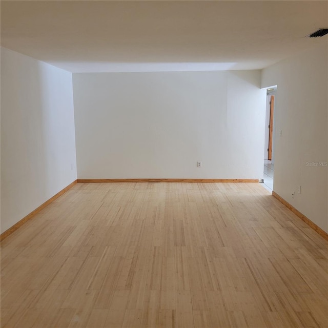 1661 Votaw Rd, Apopka, FL 32703 - empty room featuring visible vents, baseboards, and light wood-style floors