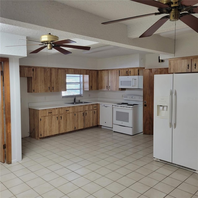 1661 Votaw Rd, Apopka, FL 32703 - kitchen with a sink, a textured ceiling, white appliances, light countertops, and ceiling fan