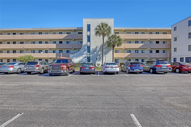 2465 S Washington Ave Unit A402, Titusville, FL 32780 - view of building exterior featuring uncovered parking