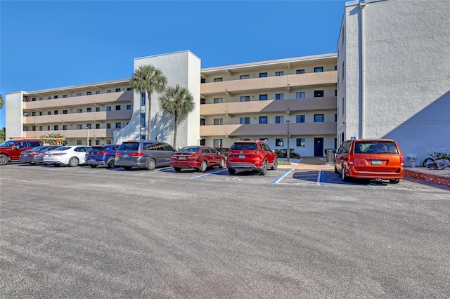 2465 S Washington Ave Unit A402, Titusville, FL 32780 - view of building exterior with uncovered parking
