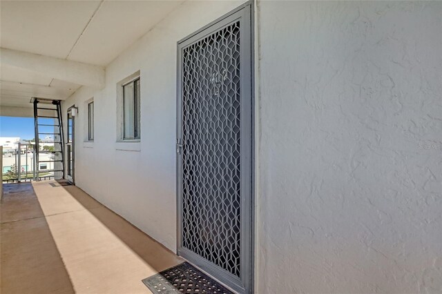 2465 S Washington Ave Unit A402, Titusville, FL 32780 - view of exterior entry with stucco siding