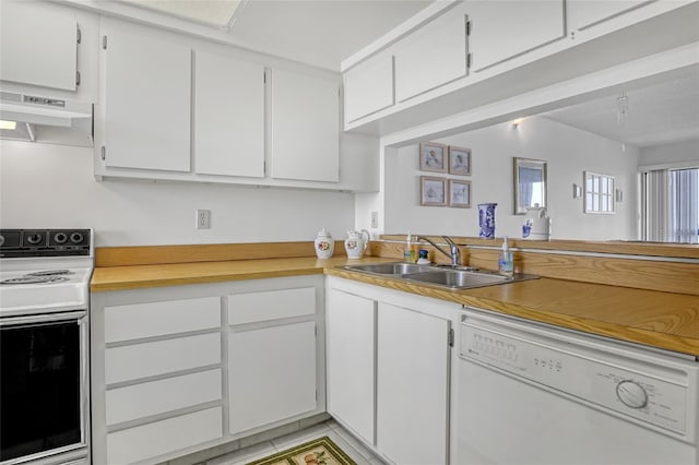 2465 S Washington Ave Unit A402, Titusville, FL 32780 - kitchen with a sink, under cabinet range hood, white cabinetry, range, and dishwasher