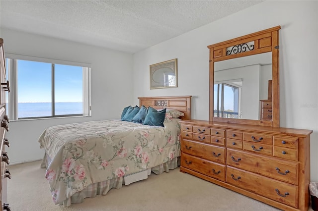 2465 S Washington Ave Unit A402, Titusville, FL 32780 - carpeted bedroom featuring a textured ceiling