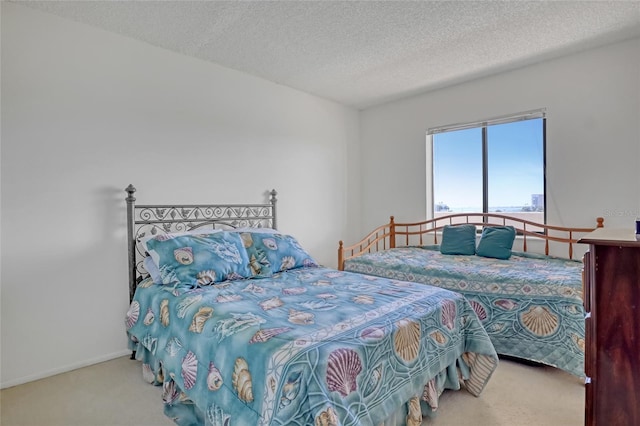 2465 S Washington Ave Unit A402, Titusville, FL 32780 - bedroom featuring carpet flooring, a textured ceiling, and baseboards