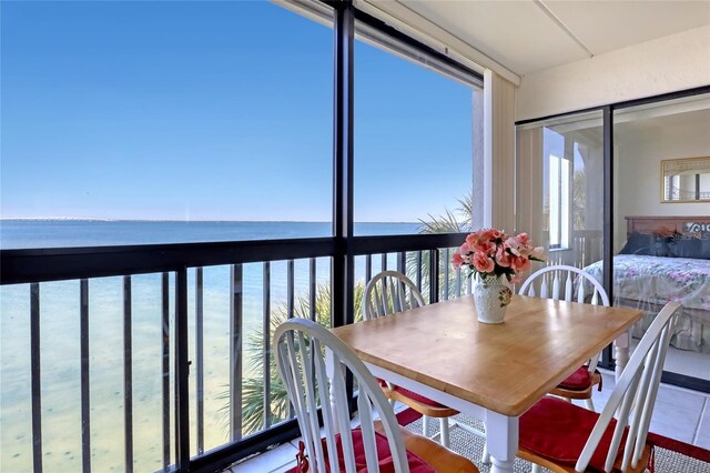 2465 S Washington Ave Unit A402, Titusville, FL 32780 - sunroom featuring a water view