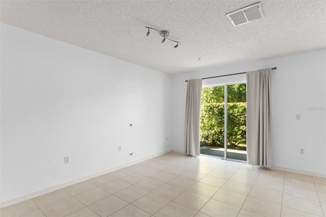 435 Tradition Ln, Winter Springs, FL 32708 - spare room with light tile patterned flooring, a textured ceiling, and visible vents