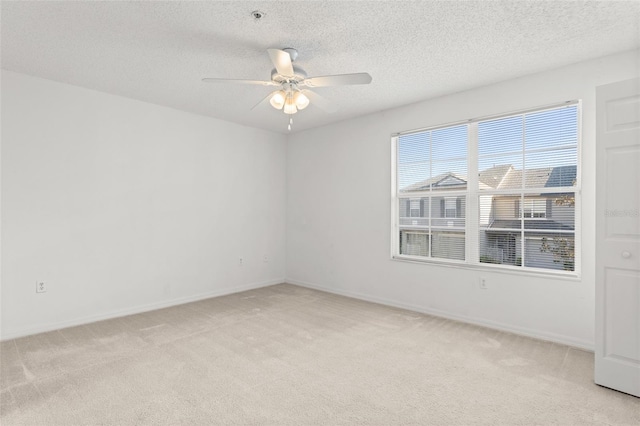 435 Tradition Ln, Winter Springs, FL 32708 - unfurnished room featuring light carpet, a textured ceiling, baseboards, and ceiling fan