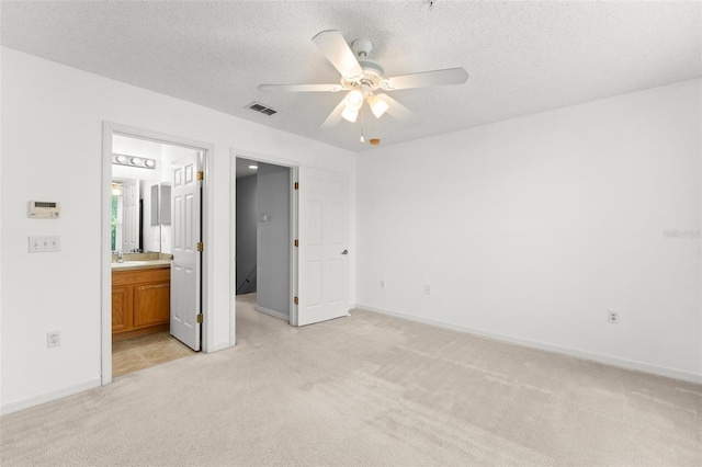 435 Tradition Ln, Winter Springs, FL 32708 - unfurnished bedroom with light colored carpet, visible vents, baseboards, and a textured ceiling