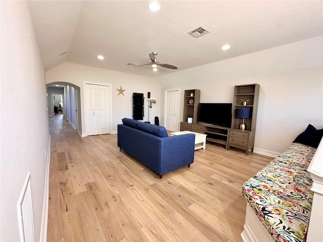 1570 Oakford Rd, Sarasota, FL 34240 - living area with arched walkways, lofted ceiling, light wood-style flooring, a ceiling fan, and recessed lighting