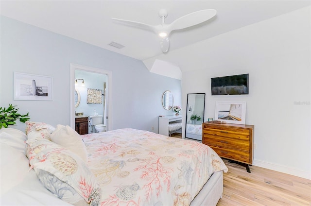 1570 Oakford Rd, Sarasota, FL 34240 - bedroom featuring lofted ceiling, light wood-style flooring, baseboards, ensuite bathroom, and ceiling fan