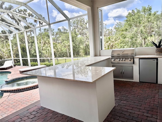1570 Oakford Rd, Sarasota, FL 34240 - unfurnished sunroom with exterior kitchen and a jacuzzi