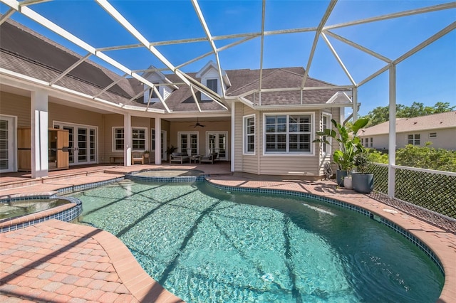1570 Oakford Rd, Sarasota, FL 34240 - view of swimming pool with french doors, a pool with connected hot tub, a patio, ceiling fan, and a lanai