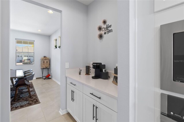 3121 Buffington Pl, Oviedo, FL 32765 - kitchen featuring light countertops, white cabinetry, recessed lighting, and baseboards