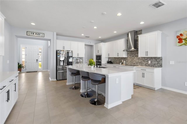 3121 Buffington Pl, Oviedo, FL 32765 - kitchen with wall chimney exhaust hood, appliances with stainless steel finishes, decorative backsplash, a breakfast bar, and recessed lighting