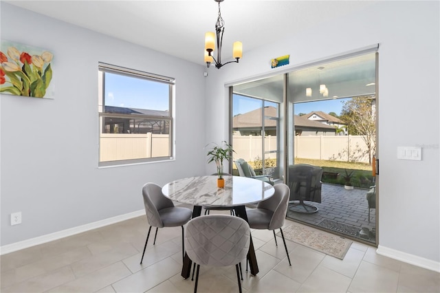 3121 Buffington Pl, Oviedo, FL 32765 - dining area featuring a chandelier and baseboards