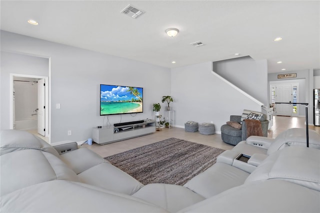 3121 Buffington Pl, Oviedo, FL 32765 - living area featuring baseboards, stairway, and recessed lighting
