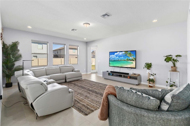 3121 Buffington Pl, Oviedo, FL 32765 - living room featuring recessed lighting, baseboards, a textured ceiling, and tile patterned floors