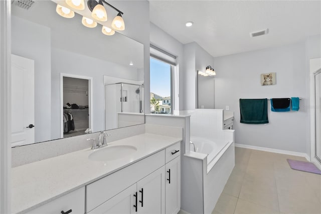 3121 Buffington Pl, Oviedo, FL 32765 - full bath featuring a stall shower, vanity, a garden tub, and a spacious closet