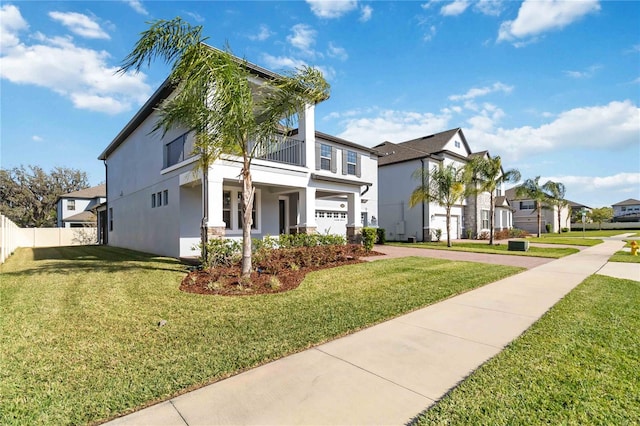 3121 Buffington Pl, Oviedo, FL 32765 - view of front of house featuring driveway, stucco siding, a balcony, and a residential view