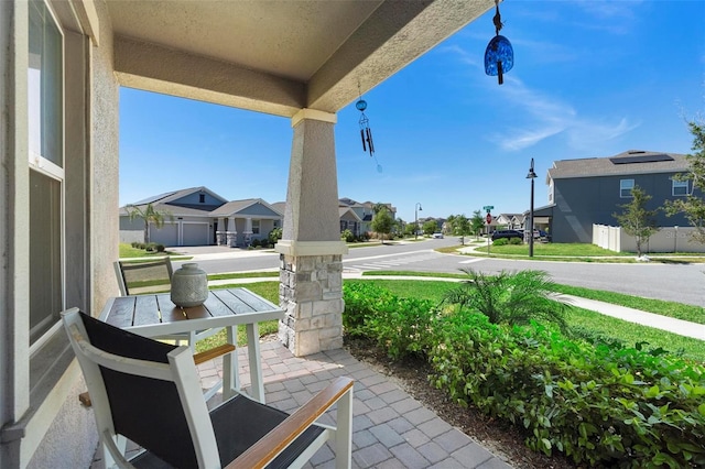 5052 Blanchard Ct, Saint Cloud, FL 34772 - view of patio featuring a porch and a residential view