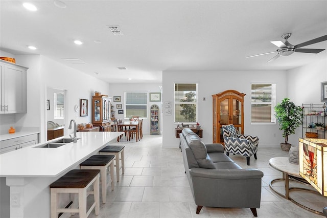 5052 Blanchard Ct, Saint Cloud, FL 34772 - living room featuring light tile patterned flooring, visible vents, a healthy amount of sunlight, and ceiling fan