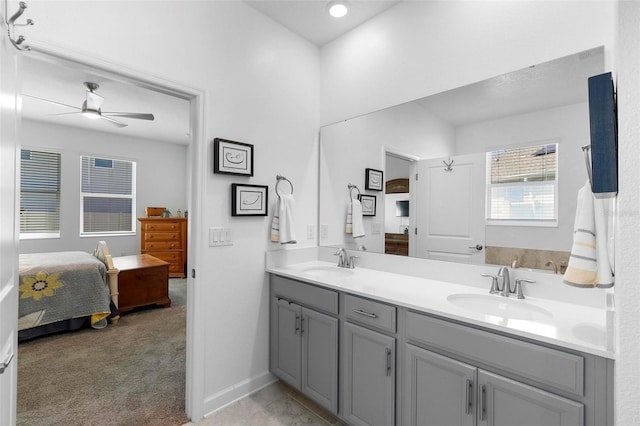 5052 Blanchard Ct, Saint Cloud, FL 34772 - full bathroom featuring a sink, connected bathroom, a ceiling fan, and double vanity