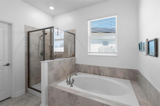5052 Blanchard Ct, Saint Cloud, FL 34772 - bathroom with tile patterned floors, a bath, and a shower stall