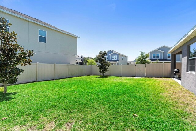5052 Blanchard Ct, Saint Cloud, FL 34772 - view of yard with a fenced backyard and a gate