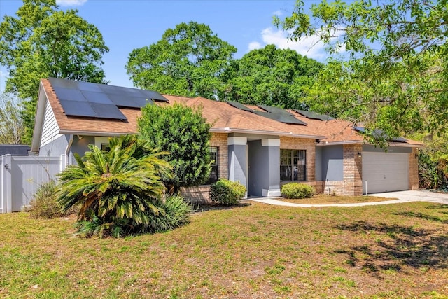 10400 Hunters Trail Ct, Orlando, FL 32817 - ranch-style house with brick siding, a front lawn, fence, concrete driveway, and an attached garage