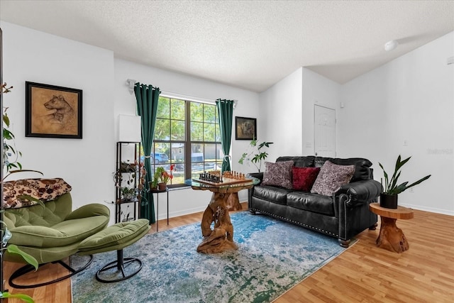 10400 Hunters Trail Ct, Orlando, FL 32817 - living area with a textured ceiling, baseboards, and wood finished floors
