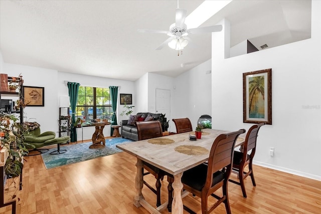 10400 Hunters Trail Ct, Orlando, FL 32817 - dining space featuring light wood-type flooring, visible vents, a ceiling fan, baseboards, and vaulted ceiling