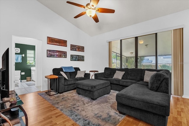 10400 Hunters Trail Ct, Orlando, FL 32817 - living area with wood finished floors, a ceiling fan, and high vaulted ceiling