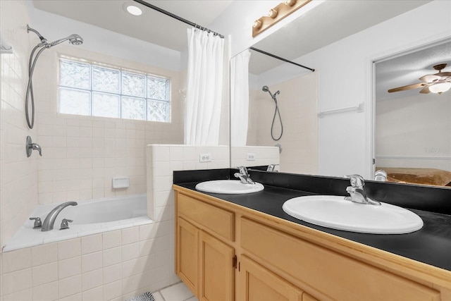 10400 Hunters Trail Ct, Orlando, FL 32817 - bathroom with double vanity, a ceiling fan, tiled shower / bath, and a sink