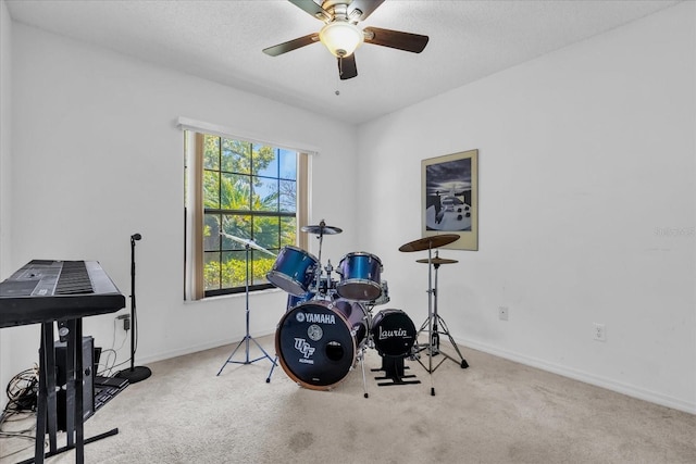 10400 Hunters Trail Ct, Orlando, FL 32817 - workout room featuring a ceiling fan, carpet, baseboards, and a textured ceiling