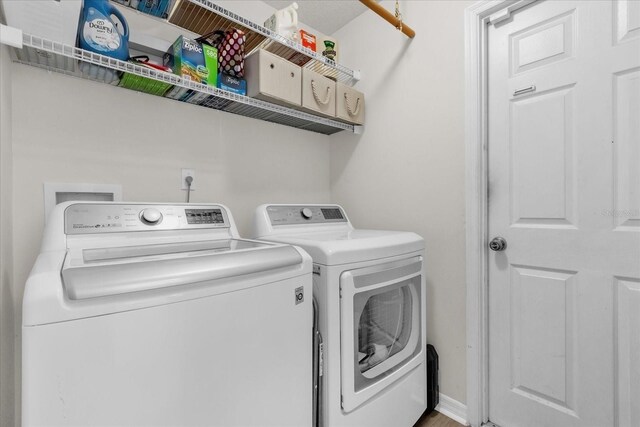 10400 Hunters Trail Ct, Orlando, FL 32817 - clothes washing area with laundry area and washing machine and dryer