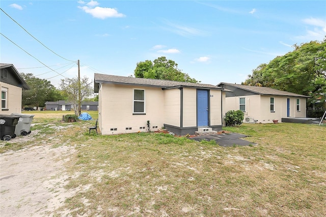 626 Marvin C Zanders Ave, Apopka, FL 32703 - rear view of house with a lawn and entry steps