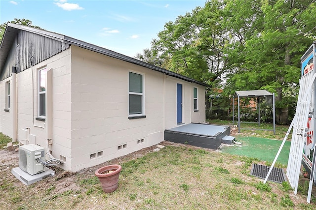 626 Marvin C Zanders Ave, Apopka, FL 32703 - exterior space with a lawn, concrete block siding, and ac unit