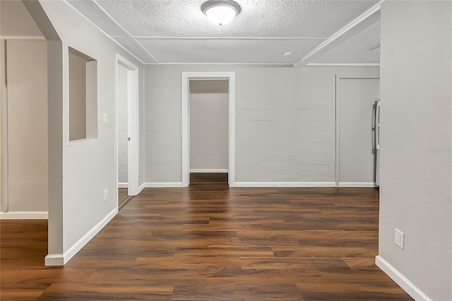626 Marvin C Zanders Ave, Apopka, FL 32703 - unfurnished room featuring dark wood-type flooring, baseboards, and a textured ceiling