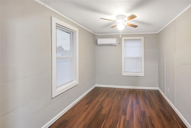 626 Marvin C Zanders Ave, Apopka, FL 32703 - spare room featuring crown molding, baseboards, a wall mounted air conditioner, dark wood-style floors, and a ceiling fan