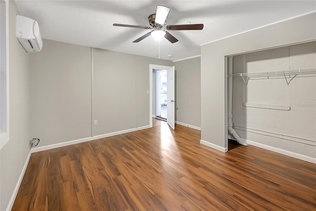 626 Marvin C Zanders Ave, Apopka, FL 32703 - unfurnished bedroom featuring ceiling fan, a wall mounted air conditioner, baseboards, and wood finished floors