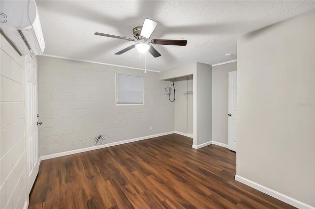 626 Marvin C Zanders Ave, Apopka, FL 32703 - empty room featuring wood finished floors, baseboards, a wall mounted AC, ceiling fan, and a textured ceiling