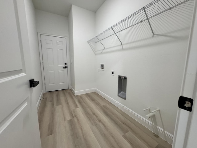 washroom featuring baseboards, laundry area, hookup for a washing machine, light wood-style flooring, and electric dryer hookup