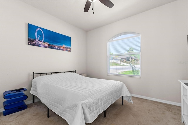bedroom featuring baseboards, carpet, and a ceiling fan