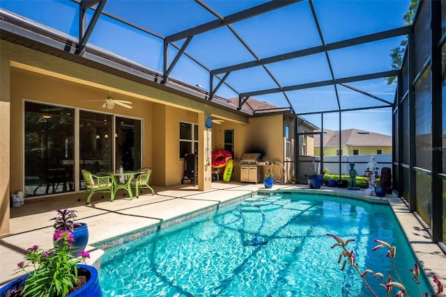 view of pool with ceiling fan, a lanai, a patio, and a fenced in pool
