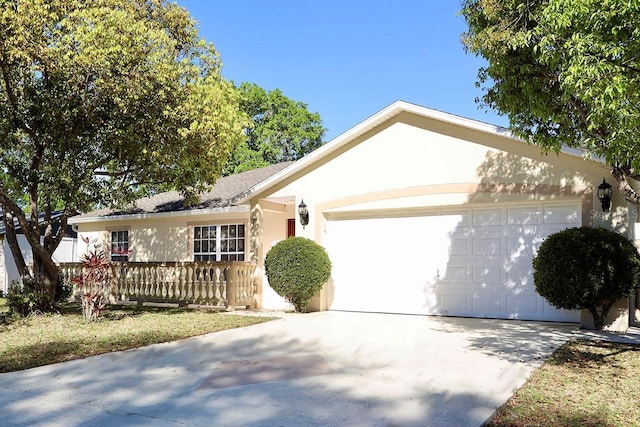 7 Sequoia Way, Kissimmee, FL 34758 - ranch-style house featuring a garage, concrete driveway, and stucco siding