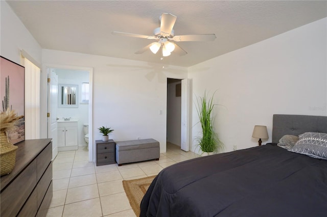 7 Sequoia Way, Kissimmee, FL 34758 - bedroom featuring light tile patterned floors, ceiling fan, a sink, and ensuite bath